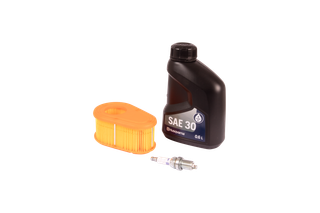 Top view of a Husqvarna oil bottle, air filter, and spark plug.