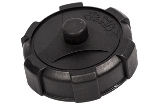 Top view of a fuel tank cap for outdoor power equipment.