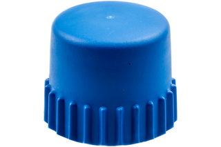 Top view of a plastic cap with ribbed edges.