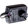 Ovenfra af en Husqvarna AC/DC-adapter med synlige specifikationer og stik.