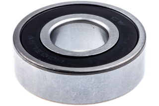 Close-up view of a metal ball bearing with a black seal.
