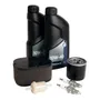 Top view of Husqvarna maintenance kit including oil bottles, spark plugs, air filter, and oil filter.