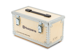 Front view of a Husqvarna wooden storage box with metal reinforcements and a handle.