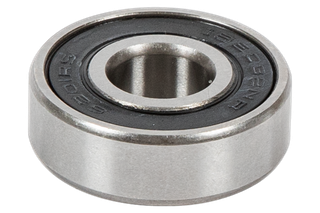 Close-up view of a metal bearing with engraved text on its side.