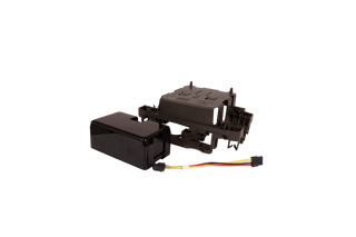 Top view of a plastic component with attached wiring harness.