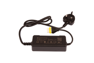 Top view of a Husqvarna Group power adapter with UK plug and safety certifications.