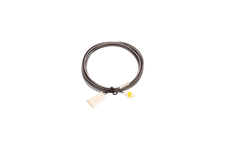 Top view of a coiled electrical cable with connectors.