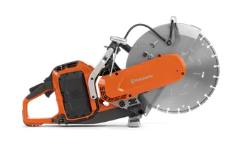 Side view of a Husqvarna power cutter with a large circular blade.
