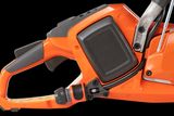 Side view of a chainsaw handle and control panel.