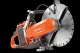 Side view of a Husqvarna power cutter with a large circular blade.