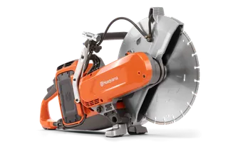 Side view of a Husqvarna power cutter with a large circular blade.