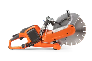 Side view of a Husqvarna power cutter with a large circular blade.