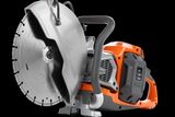 Side view of a Husqvarna power cutter with ergonomic handle.