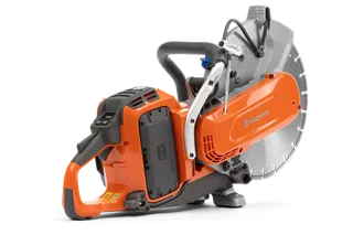 Side view of a Husqvarna power cutter showcasing its ergonomic handle and blade.