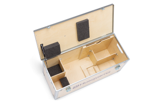 Top view of an open Husqvarna storage box with compartments and foam padding.
