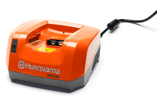 Front view of a Husqvarna battery charger with a power cord.