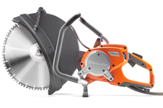Side view of a Husqvarna power cutter with a large circular blade.