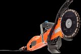 Side view of a Husqvarna construction power cutter with a visible blade.