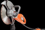 Side view of a Husqvarna construction power cutter with ergonomic handle.