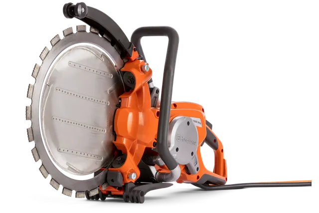 Side view of a Husqvarna construction power cutter with ergonomic handle.