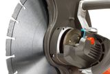 Close-up view of a power cutter blade and motor components.