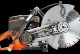 Side view of a construction power cutter with exposed internal components.
