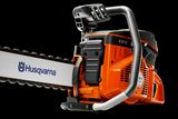 Side view of a Husqvarna K970 power cutter with ergonomic handle and blade.