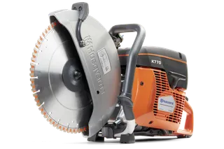 Side view of a Husqvarna K770 power cutter, showcasing its blade and ergonomic handle.