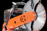 Side view of a Husqvarna power cutter with a large circular blade.