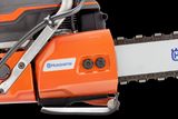 Side view of a Husqvarna chainsaw showcasing the blade and engine casing.
