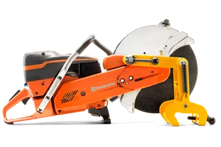 Side view of a Husqvarna power cutter with a circular blade and ergonomic handle.
