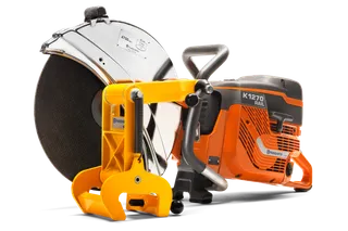 Side view of a Husqvarna K1270 Rail power cutter with a rail clamp attachment.
