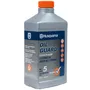Front view of a Husqvarna Oil Guard 2-stroke oil bottle with product details visible.
