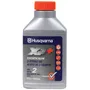 Front view of a Husqvarna 2-stroke oil bottle with product details on the label.