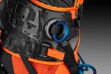 Close-up of a harness with adjustable straps and a metal ring attachment.