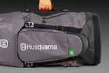 Side view of a Husqvarna equipment bag with a first aid symbol.