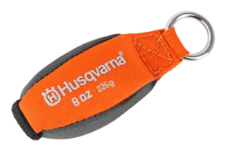 Vue de face d’un accessoire de la marque Husqvarna avec un anneau en métal sur lequel sont identifiés les détails de poids.