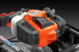 Studio close-up of a Husqvarna garden tool engine with throttle handle and controls.