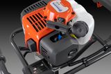 Close-up view of a Husqvarna construction product showcasing its engine and control panel.