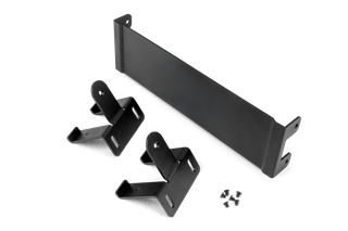 Metal brackets and screws arranged on a surface.