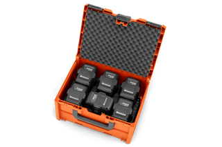 Top view of an open case containing multiple Husqvarna batteries.