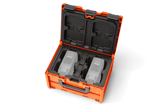 Top view of a storage case with foam inserts, designed to hold equipment securely.