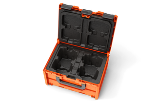 Top view of an open battery case with foam compartments.