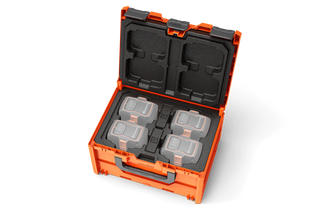 Box na akumulátory B1-UN Husqvarna. Top view of an open tool case with custom foam inserts for organizing tools.