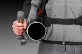 A person holding a handheld blower, focusing on the handle and nozzle.