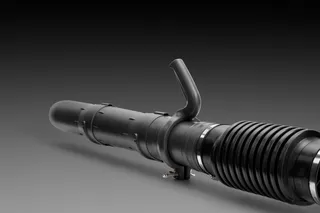 Side view of a black industrial hose with a handle, designed for heavy-duty applications.