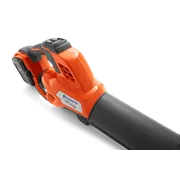 Side view of a Husqvarna leaf blower showcasing its ergonomic handle and battery compartment.