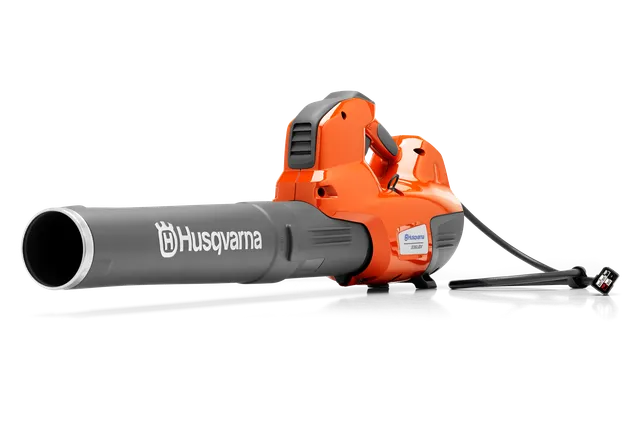 Side view of a Husqvarna leaf blower with a visible power cord.