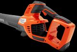 Side view of a Husqvarna leaf blower showcasing its ergonomic handle and air intake.