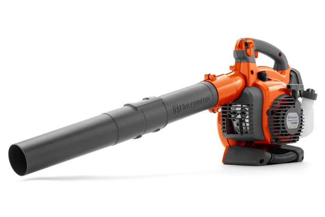 Side view of a Husqvarna leaf blower with ergonomic handle and air intake visible.